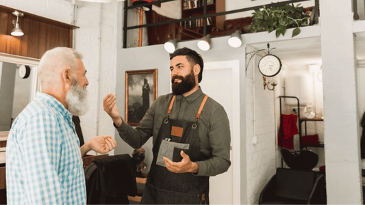 Barber and client in conversation during a haircut.