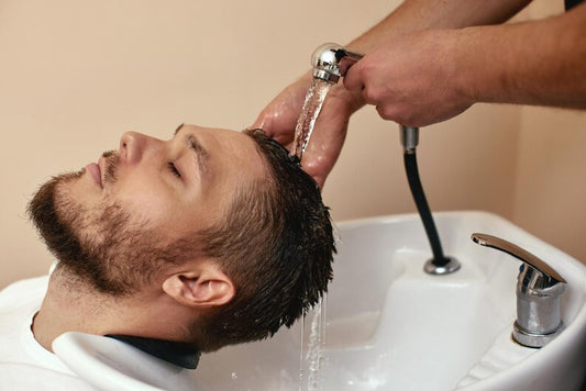 Man washing hair with sulfate-free shampoo