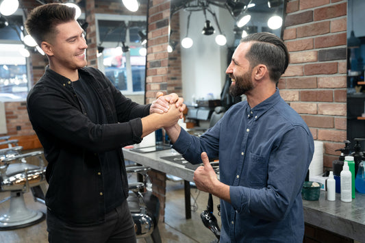 Barber consulting client on hairstyle choice