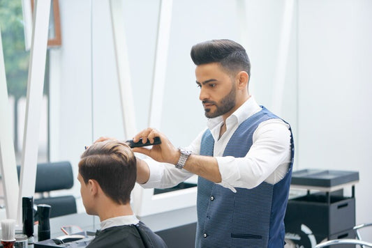 Client in salon chair getting a clean, professional haircut