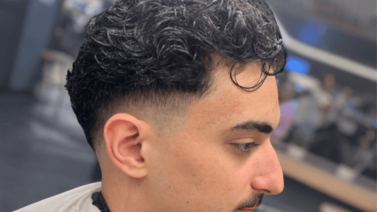 A crisp skin fade finished by a professional barber at Allan’s salon