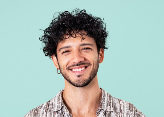 Curly men’s haircut styled by barber