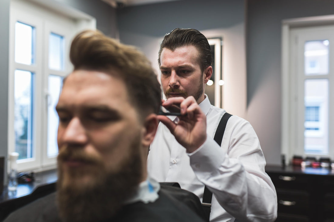Barber styling hair with precision