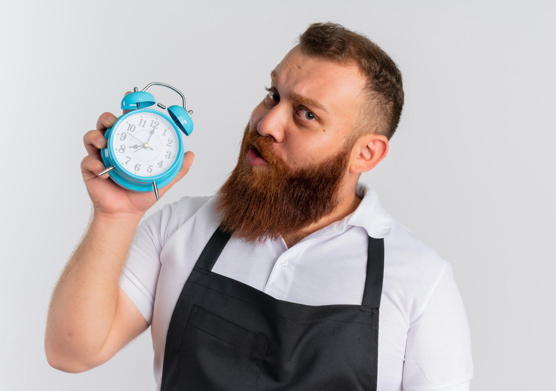 Haircut tools with a clock showing scheduled time